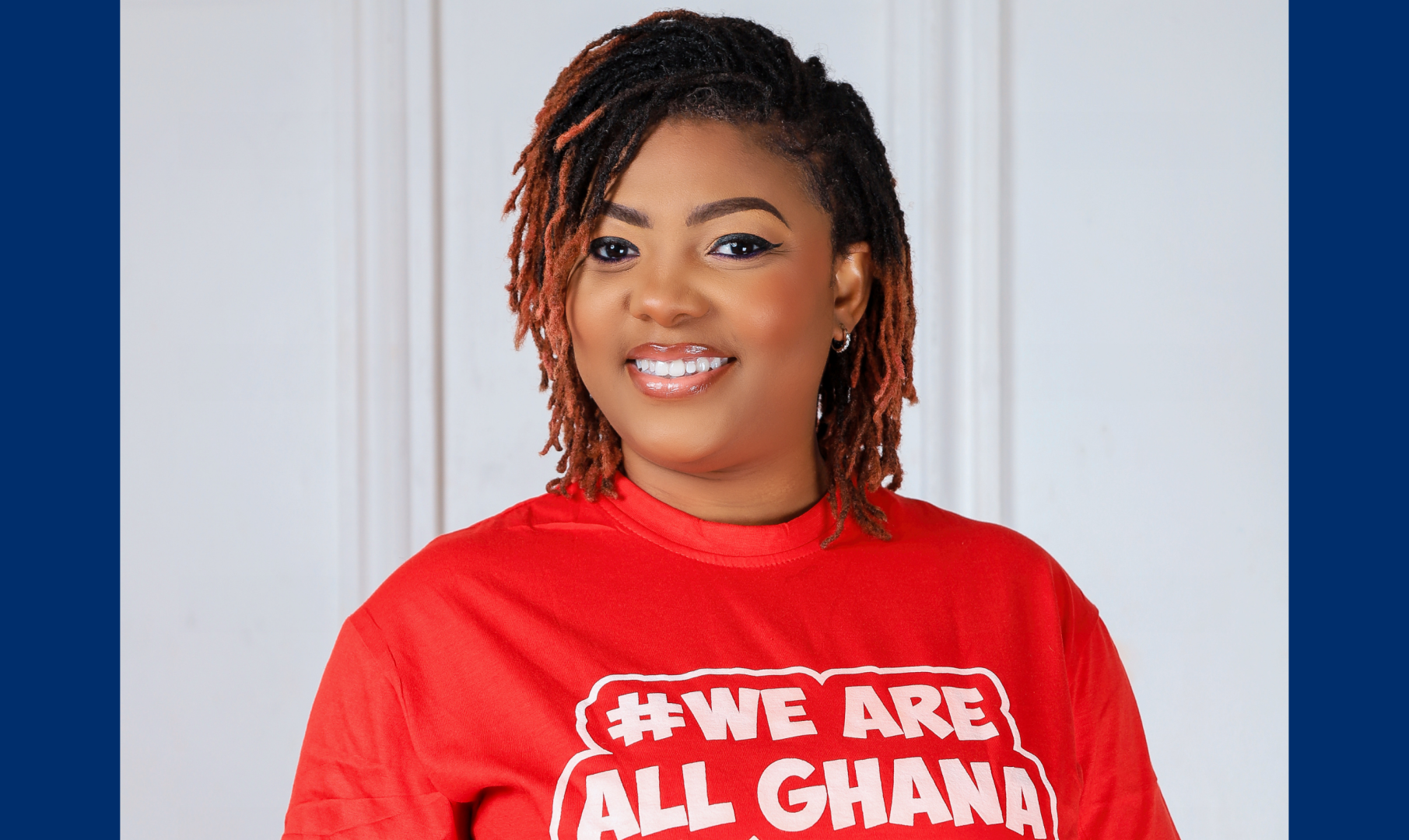 Portrait shot of Roslyn in a red t-shirt that reads "WE ARE ALL GHANA"
